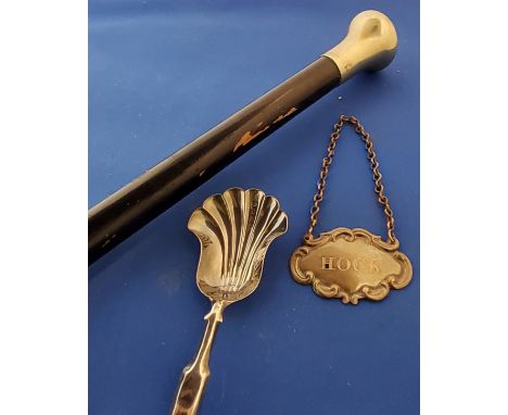 A Victorian silver caddy spoon, shell shaped bowl, Birmingham 1864;&nbsp; a plated decanter label, Hock;&nbsp; a gentleman's 