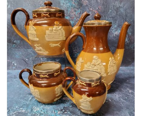 A Royal Doulton stoneware teapot, milk jug and sugar bowl, each sprigged in white with jolly topers, windmills and foliage, s