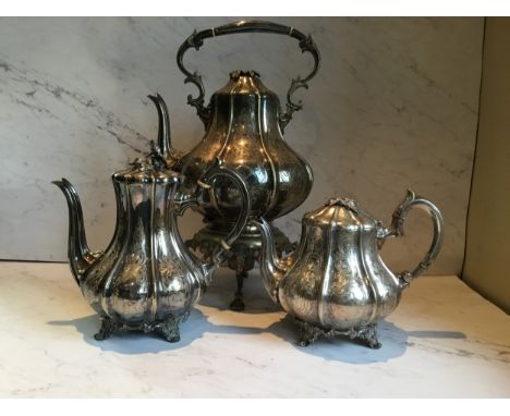 A Victorian part E.P.N.S. tea service, of fluted baluster form, comprising tea kettle on stand, coffee pot and tea pot, the t