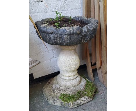 A reconstituted stone pedestal acanthus capped planter / urn 