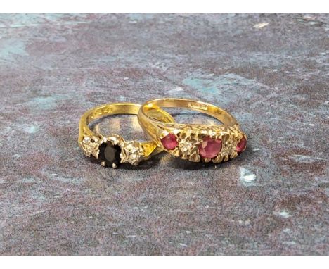 A 9ct gold five stone ring set with a central round ruby, flanked by two round diamonds and further two rubies, size K 3.2g; 