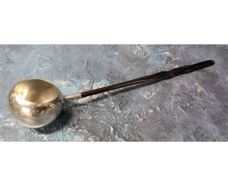 A 19th century Scottish silver plated toddy ladle, wrythen handle, the globular bowl engraved, 35cm long 