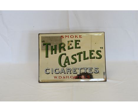An advertising mirror for Three Castles Cigarettes, manufactured by W.D & H.O. Wills.  12 by 9ins.  Est £20-40