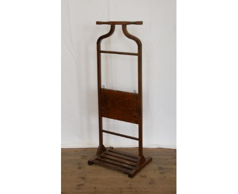 An Edwardian valet stand with central tie press and slatted base.  Est £20-40