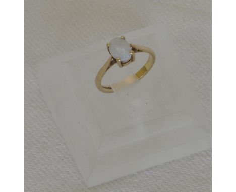 A 9ct gold ring set with an oval opal.  Est £20-40