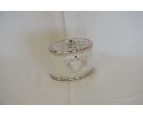 A Sheffield plate tea caddy with loop finial and acanthus leaf decoration to the lid, the body with blank shield shape cartou