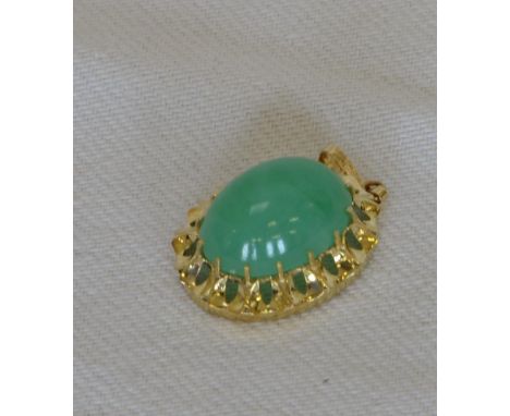 A 14ct gold pendant with pierced border and central oval jade.  Stamped to hanging loop 585.  Est £25-40