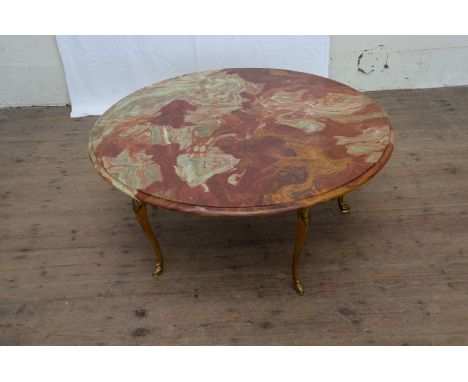 A marble circular top occasional table, on brass tripod legs.  Est £70-100