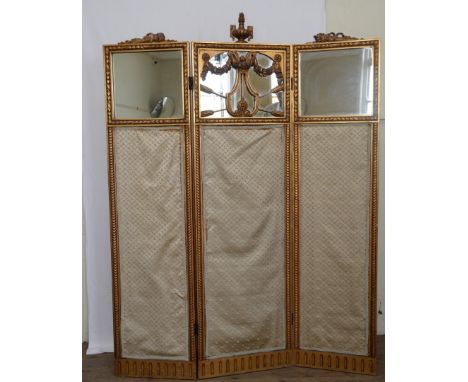 A 19th century carved and gilt three fold screen with central flaming urn finial flanked by a carved gilt quiver of arrows to