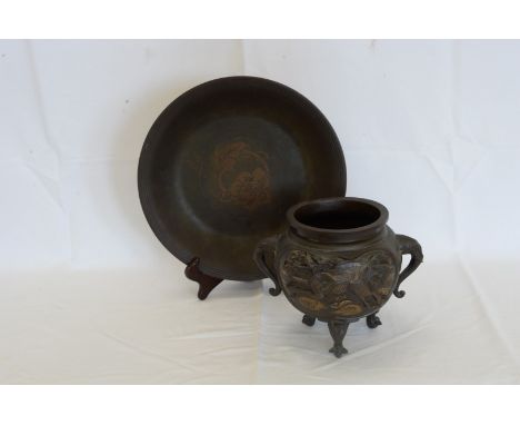 A Chinese bronze censer with raised dragon decoration, elephant mask handles and on elephant feet and an oriental bronze tray