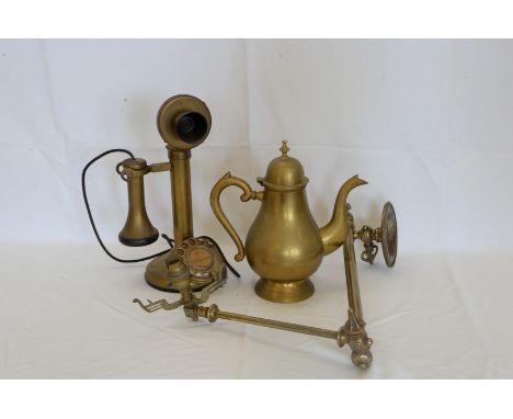 A quantity of brassware including brass candlesticks, bracket light fittings, kettles, brass saucepans etc.  Est £40-60