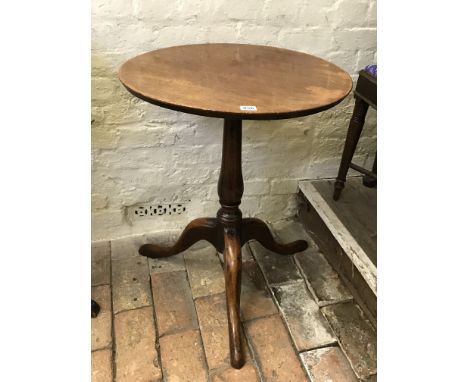 A Georgian mahogany circular occasional table on vase shaped turned stem, tripod legs and pad feet.  21¾ins diameter.  Est £3