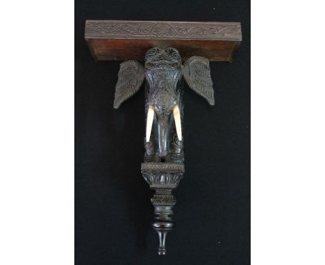 ELEPHANT SHELF - a carved wooden Indian elephant shelf with ivory tusks. 