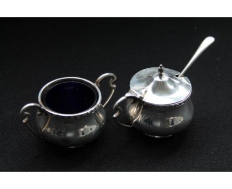 SILVER BOWLS - two Sheffield hallmarked Walker & Hall bowls (salt and mustard) dated 1917. Both to include blue glass liners.