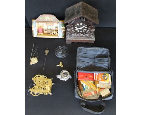 CUCKOO CLOCK - a 1900s wooden cuckoo clock with a bag featuring a clock movement, springs and tools and a Swiss scene wall mo