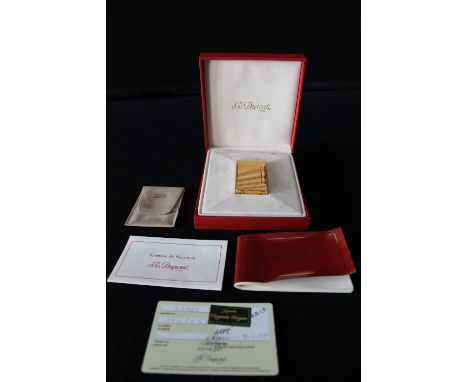 DUPONT LIGHTER - a Dupont gold plated lighter in original box complete with paperwork.