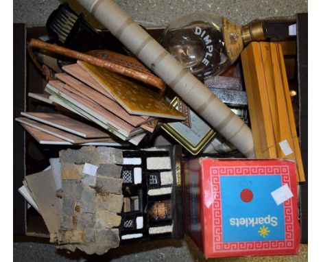 Boxes and Objects - an unopened bottle of Spanish rose wine in a wicker basket; a vintage nodding dog; a boxed Sparklets Host