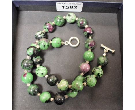 A multi coloured hard stone globular bead necklace, 925 silver bar and ring clasp, stamped 925, 46cm long, boxed
