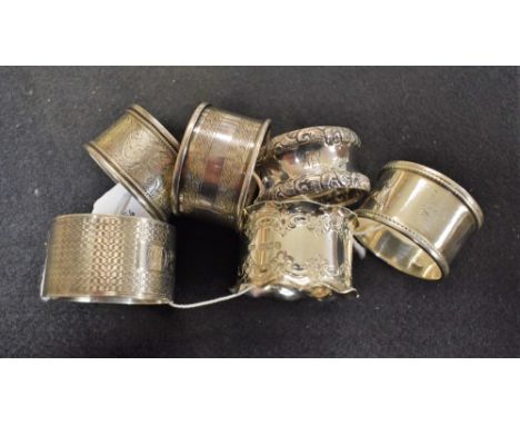 A silver engine turned napkin ring, Birmingham 1942; five other silver napkin rings (5)