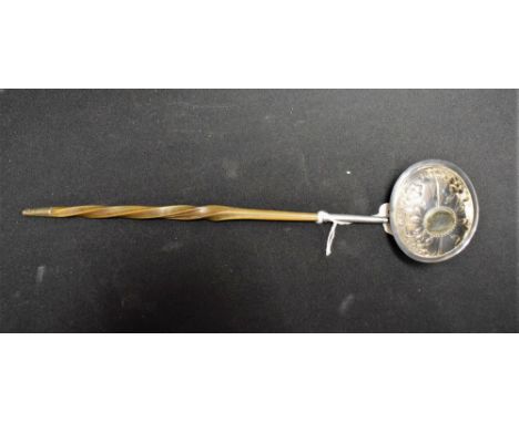 A George III silver toddy ladle, twisted whale bone haft, London  1787