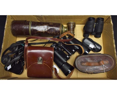 A pair of Nikon Travelite V 9x25 binoculars; A pair of Carl Zeiss Jena 8x30 Jenoptem binoculars, cased; A pair of W.Watson & 