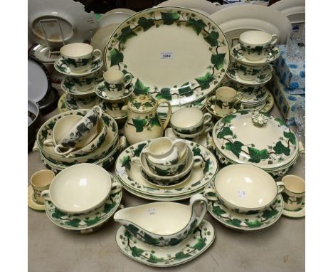 A Wedgwood Napolean Ivy part dinner and tea service comprising dinner plates, side plates, vegetable dishes, serving dishes, 