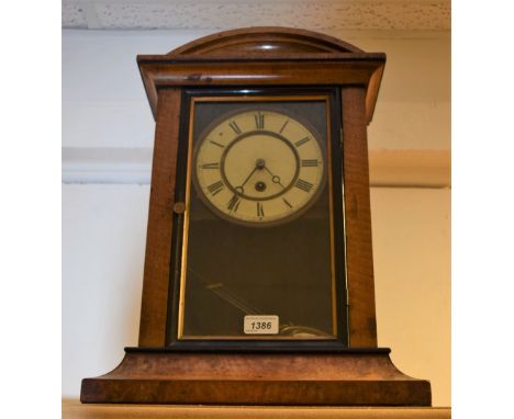 A late Victorian ebonsied walnut mantel clock 