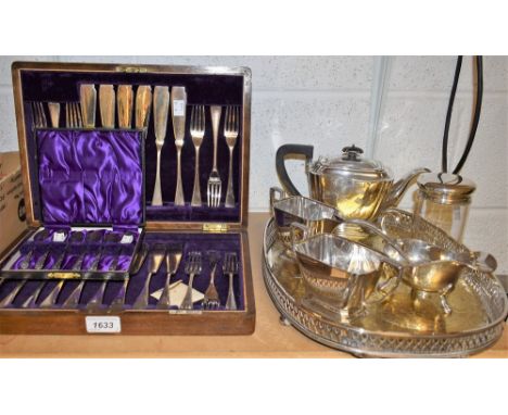 A cylindrical glass jar, silver screw cover, Sheffield 1928; an EPNS Art Deco three piece tea service on associated tray; an 