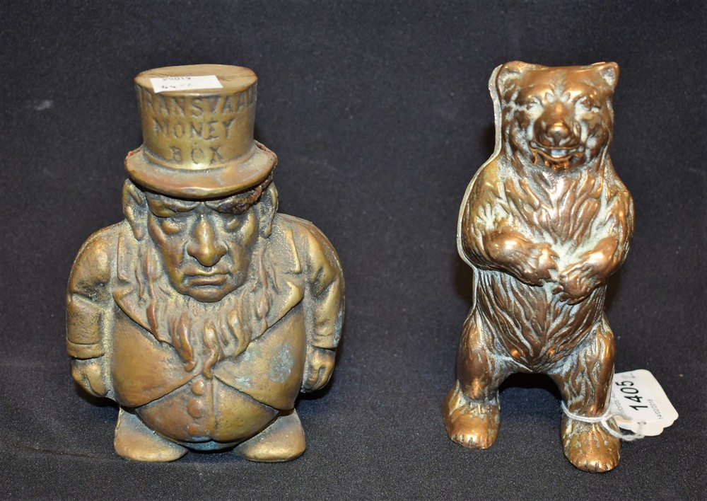 A Victorian brass bear money box; a Kruger Transvaal money box (2)