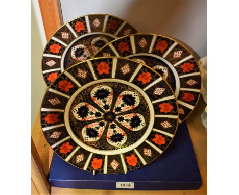 A Royal Crown Derby 1128 pattern plate, 27cm, first quality, boxed; others, first and second quality (3)