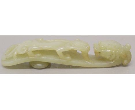 A CHINESE CELADON JADE BELT HOOK, of traditional form, 4.4in long.