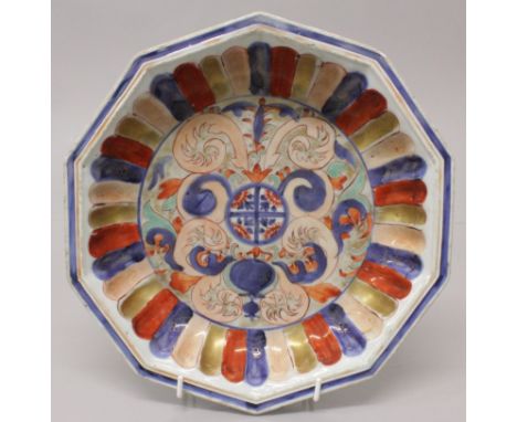 AN UNUSUAL EARLY 18TH CENTURY CHINESE IMARI PORTUGUESE MARKET OCTAGONAL DEEP PORCELAIN DISH, painted to the interior in under