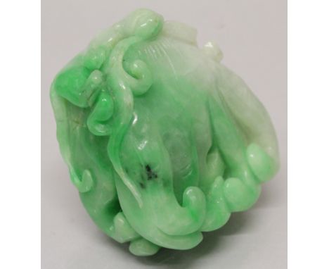 A CHINESE APPLE GREEN JADE-LIKE MODEL OF A FINGER CITRON, 1.8in x 1.7in at widest points.