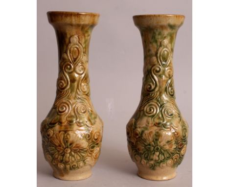 A PAIR OF ORIENTAL MOULDED CERAMIC VASES, each pear-form body decorated with formal flowerheads and scrollwork, each applied 