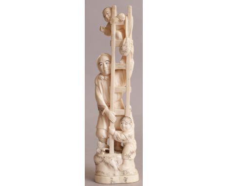 A JAPANESE MEIJI PERIOD IVORY OKIMONO OF A MAN HOLDING A LADDER, and standing on rockwork in the company of two boys, 10.25in