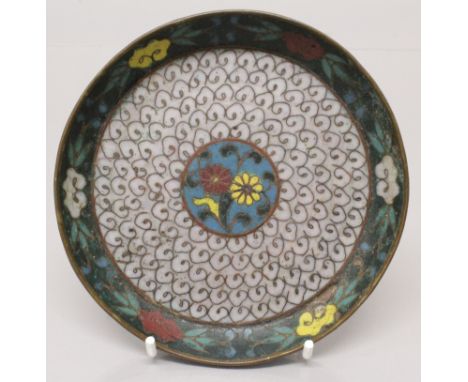 A 17TH CENTURY CHINESE MING DYNASTY CLOISONNE DISH, decorated to its centre with a floral medallion panel enclosed by a white