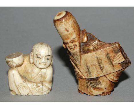 A 19TH/20TH CENTURY JAPANESE STAGHORN NETSUKE OF FUKUROKUJU, the deity holding an open scroll, 2.25in high; together with a s
