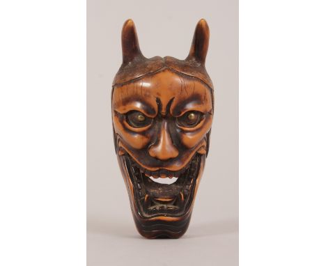 A LARGE JAPANESE MEIJI PERIOD CARVED WOOD NOH MASK NETSUKE OF HANNYA, the jealous female demon character with deeply carved f