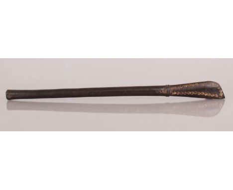 A TRIBAL OR NEAR EASTERN WOOD STICK, the handle carved with repeated circular motifs, 17.25in long.