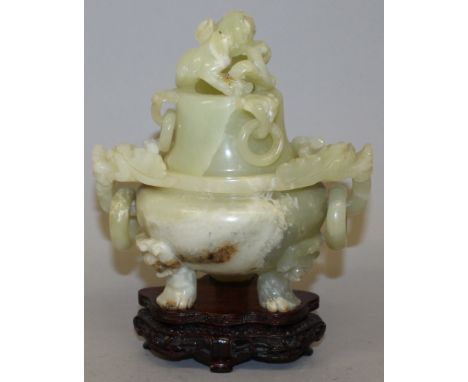 AN EARLY 20TH CENTURY CHINESE CELADON GREEN JADE CENSER & COVER, together with a fitted wood stand, with loose ring handles, 