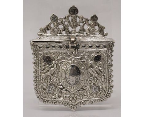 A 19TH CENTURY INDO-PERSIAN SILVER METAL BOX, with hinged lid, cast in relief and with a few small areas of black enamel inla