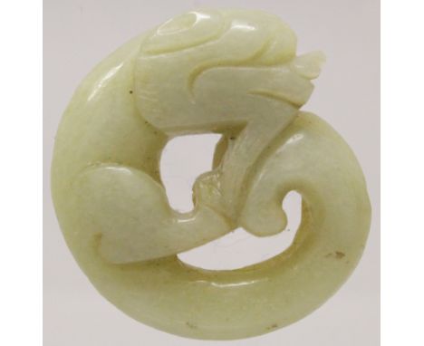 A CHINESE PIERCED CELADON JADE MODEL OF A CHILONG, 2.1in x 2in at widest points.