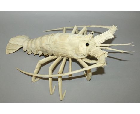 A LARGE JAPANESE MEIJI PERIOD ARTICULATED BONE IVORY MODEL OF A CRAYFISH, with moveable claws, feet, antenna and tail, the wh