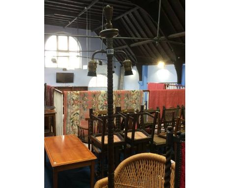 A turned wood standard lamp