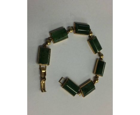 A jade bracelet with 9ct mount