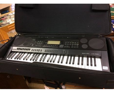 A Casio CTK 7000 keyboard and stand
