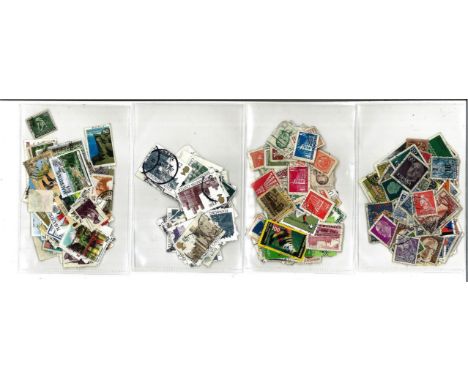 Worldwide stamp collection 4 small glory bags includes 1, Europe, 1 Rest of the world, 1 bag high defs and 1 bag British Comm