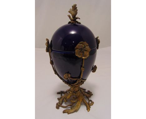 A continental egg shaped ceramic vase and cover with ormolu naturalistic mounts 38cm (h)