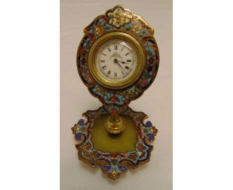 A Swiss gilded metal and cloisonn‚ desk clock with white enamel dial and Roman numerals on shaped oval base, 12.5cm (h)