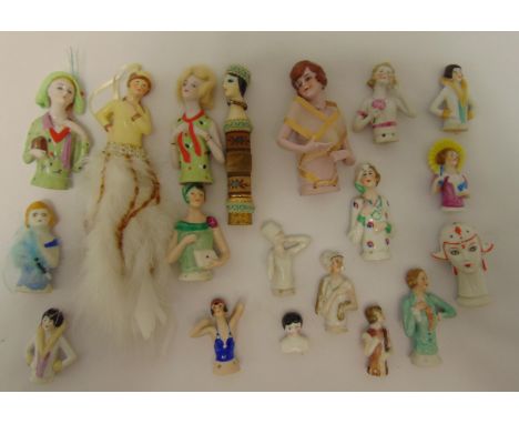Eighteen ceramic half dolls of varying size and style